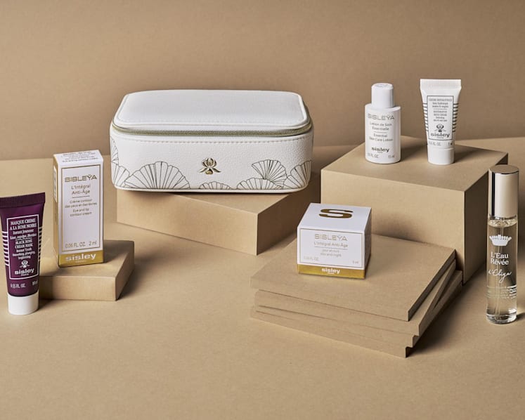 The Sisley women’s amenity kit includes, from left, the Black Rose Cream Mask, the L'Integral Anti-Age Eye And Lip Contour Cream, the L'Integral Anti-Age Cream, the Essential Skin Care Lotion, the Restorative Hand Cream and the L'Eau Revee d'Eliya fragrance. (Photo: Singapore Airlines)