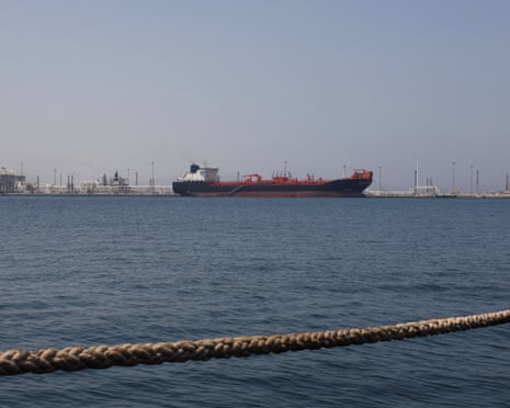 A tanker sits in the harbour at Fujairah with a mooring rope in the foreground