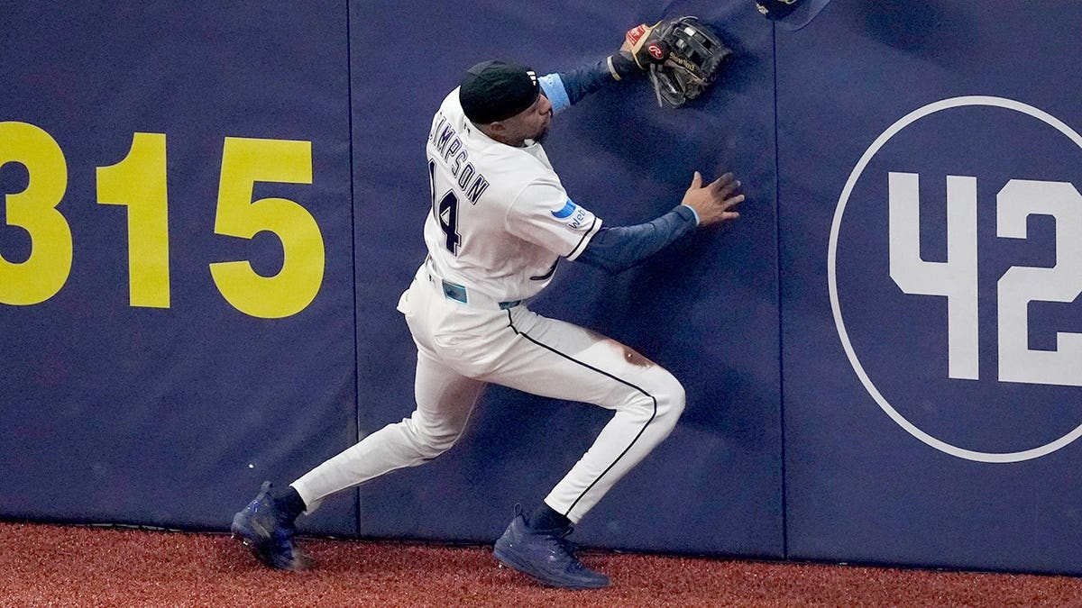 Chandler Simpson of the Tampa Bay Rays catches a fly ball hit by Sal Frelick during World Series Game 3.