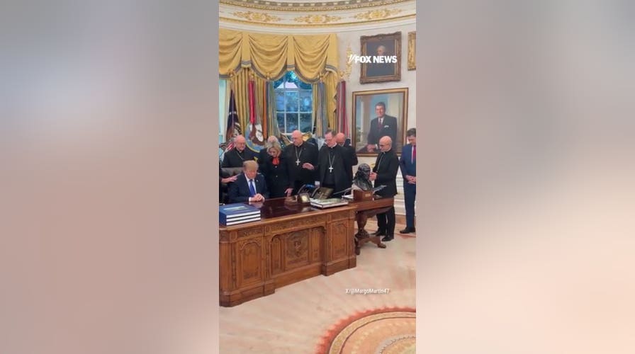 President Donald Trump shares moment of prayer with Catholic leaders in Oval Office