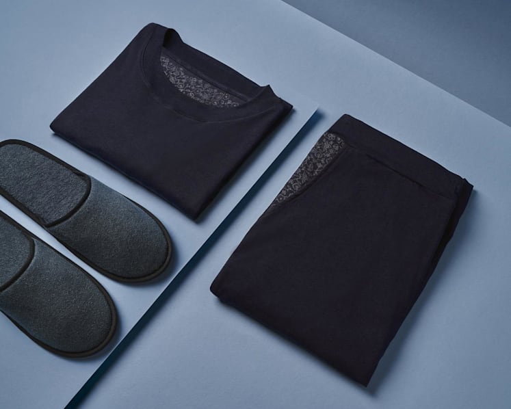 SIA is introducing sleeper suits for business class customers for the first time, with the navy blue poly-cotton sleepwear. (Photo: Singapore Airlines)