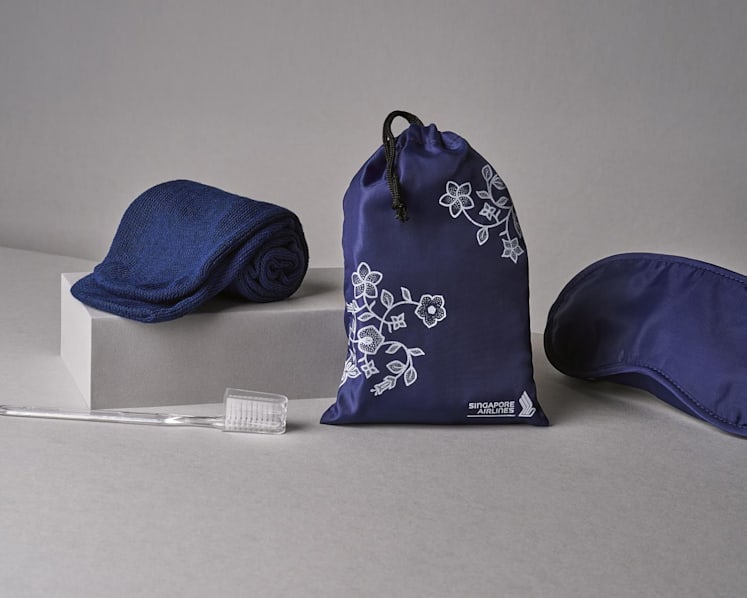SIA’s new economy class amenity kit features a collectible drawstring pouch with the airline’s batik motif, containing a selection of travel essentials. (Photo: Singapore Airlines)