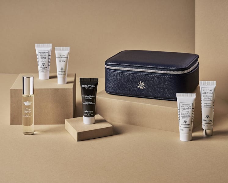 The Sisley men’s amenity kit includes, from left, the L'Eau Revee d'Alma fragrance, the Restorative Hand Cream, the Nutritive Lip Balm, the Anti-Age Mattifying Gel-Cream, the Ecological Compound, and the All Day All Year Essential Anti-Aging Protection. (Photo: Singapore Airlines)