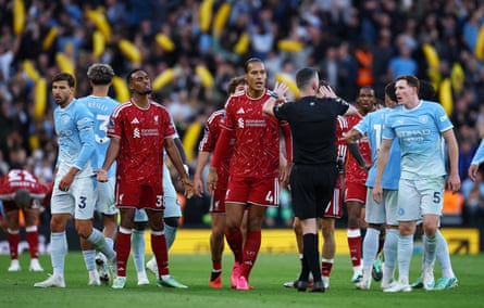 Liverpool’s Ryan Gravenberch reacts after he is shown a red card by the referee, Chris Kavanagh.